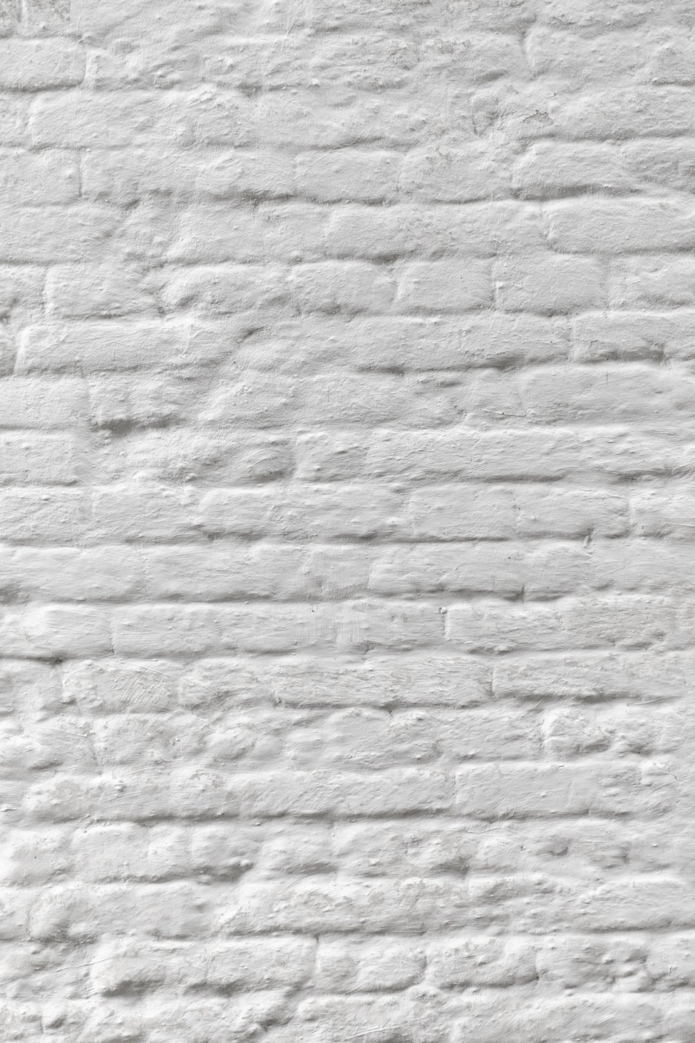 Белая кирпичная стена фон