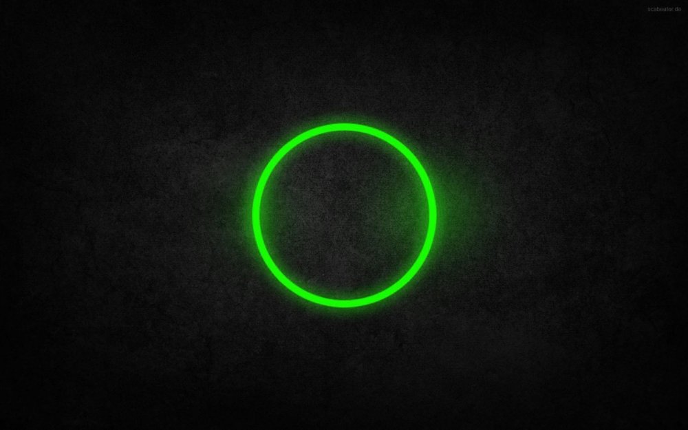 Зеленый кружок на черном фоне