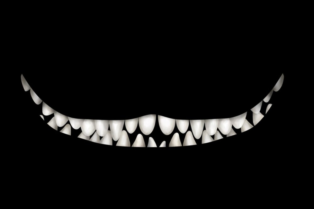 Белые зубы на черном фоне