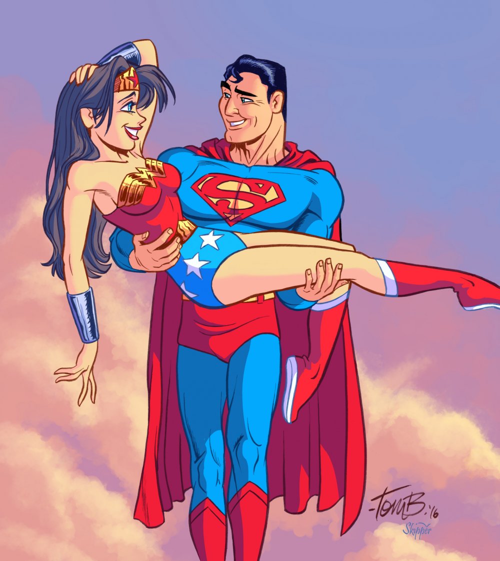 Супермен с девушкой на руках